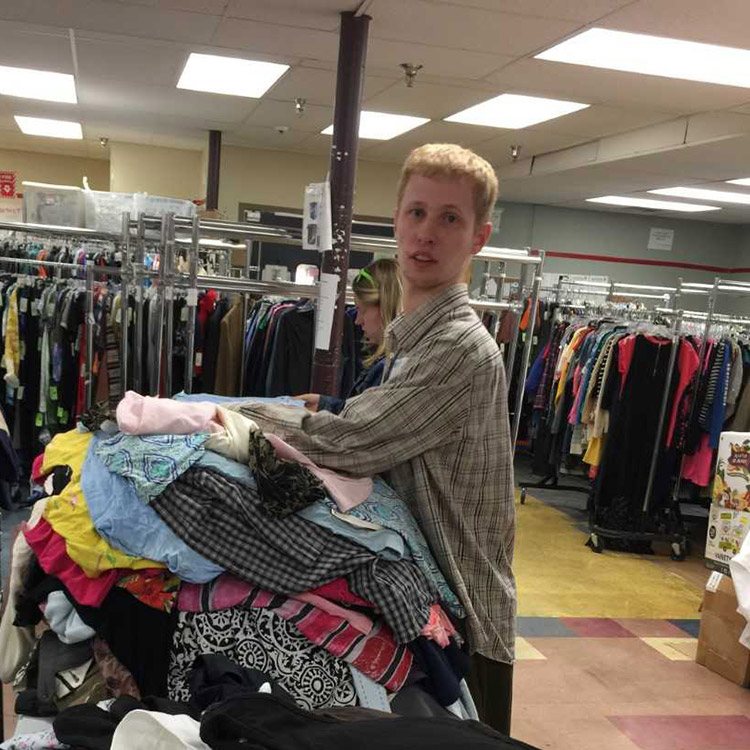 nathan Nathan with pile of clothing